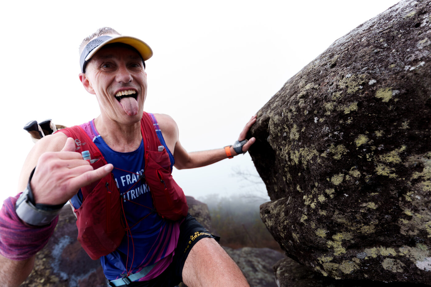 A runner having fun on a rocky climb